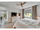 Well-lit bedroom with views of the garden, a stylish dresser, and a calming atmosphere at 19165 Iron Topsail Isle, Land O Lakes, FL 34638