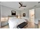 Comfortable bedroom with minimalist decor, soft lighting, and convenient access to an en-suite bathroom at 19165 Iron Topsail Isle, Land O Lakes, FL 34638