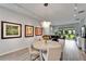 Dining area with round table and four chairs under modern lighting at 19165 Iron Topsail Isle, Land O Lakes, FL 34638