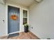 Inviting front door featuring a wreath, sidelight window, and brick walkway at 19165 Iron Topsail Isle, Land O Lakes, FL 34638