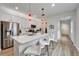 Stylish kitchen showcasing a center island with bar seating, stainless steel appliances, and modern finishes at 19165 Iron Topsail Isle, Land O Lakes, FL 34638