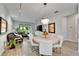 Open concept living space including dining area and living room with sliding glass doors to the backyard at 19165 Iron Topsail Isle, Land O Lakes, FL 34638