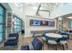 Relaxing lounge area featuring comfortable seating, ample natural light, and multiple TVs for entertainment at 19165 Iron Topsail Isle, Land O Lakes, FL 34638