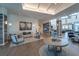 Interior view of community lounge featuring modern seating, decor, ample lighting, and access to other community spaces at 19165 Iron Topsail Isle, Land O Lakes, FL 34638