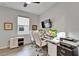 Well-lit home office featuring dual monitors, a comfortable workspace, and ample storage options at 19165 Iron Topsail Isle, Land O Lakes, FL 34638