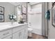 Bright bathroom with a white vanity, framed mirror and shower-tub combo at 9211 Players Dr, Weeki Wachee, FL 34613