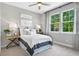 Cozy bedroom featuring soft lighting, neutral colors, and comfortable furnishings at 9211 Players Dr, Weeki Wachee, FL 34613