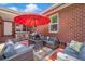 Back patio with cozy outdoor seating area and an umbrella, ideal for relaxing or entertaining guests at 2601 Upton S St, Gulfport, FL 33711
