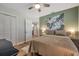 Bedroom featuring a large bed, wall decor, and an ensuite bathroom at 2601 Upton S St, Gulfport, FL 33711