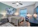 Bedroom with a work space, hardwood floor, and a wall hanging at 2601 Upton S St, Gulfport, FL 33711