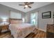 Cozy bedroom featuring wood floor, natural light, ceiling fan, and stylish decorations at 2601 Upton S St, Gulfport, FL 33711
