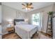 Cozy bedroom with wood floors, ceiling fan, and windows providing natural light at 2601 Upton S St, Gulfport, FL 33711