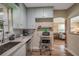Kitchen showcases gray cabinets, subway tile backsplash, and modern stainless steel appliances at 2601 Upton S St, Gulfport, FL 33711
