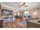 Inviting living room open to dining area with hardwood floors, neutral color palette, and abundant natural light at 2601 Upton S St, Gulfport, FL 33711