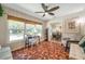 Bright office features mosaic tile floor, large windows, desk, and a view into an adjacent dining area at 2601 Upton S St, Gulfport, FL 33711