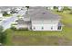 Two-story townhome exhibiting a screened-in porch and a well-maintained lawn perfect for outdoor activities at 5367 Riverwalk Preserve Dr, New Port Richey, FL 34653