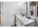 Bathroom with a marble counter and vanity, featuring modern lighting and fixtures at 5367 Riverwalk Preserve Dr, New Port Richey, FL 34653