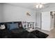 Bedroom view showcases ample space, laminate floor, personal decor, and a bright room at 5367 Riverwalk Preserve Dr, New Port Richey, FL 34653