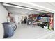 This spacious garage features epoxy flooring and ample storage for vehicles and projects at 5367 Riverwalk Preserve Dr, New Port Richey, FL 34653