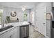 Kitchen area featuring stainless steel appliances and marble countertops at 5367 Riverwalk Preserve Dr, New Port Richey, FL 34653