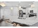 Bright kitchen with white cabinets, stainless appliances, and marble countertops at 5367 Riverwalk Preserve Dr, New Port Richey, FL 34653