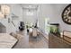 Bright living area with soaring ceilings, an open floor plan, hardwood floors, and large windows at 5367 Riverwalk Preserve Dr, New Port Richey, FL 34653