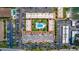 Aerial view of complex with pool, parking and landscaping at 10365 Paradise Blvd # 21, Treasure Island, FL 33706