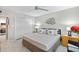 Comfortable bedroom with modern decor, natural light, and ceiling fan at 10365 Paradise Blvd # 21, Treasure Island, FL 33706