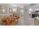 Cozy dining area with wood table, chairs, and decorative mirrors at 10365 Paradise Blvd # 21, Treasure Island, FL 33706