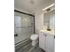 Modern bathroom with a glass-enclosed shower, sleek vanity, and updated fixtures at 4546 Ontario Dr, New Port Richey, FL 34652