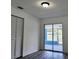 Bedroom with closet and sliding glass door to porch at 4546 Ontario Dr, New Port Richey, FL 34652