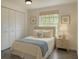 Comfortable bedroom with built in storage, window and stylish decor at 4546 Ontario Dr, New Port Richey, FL 34652