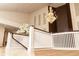 Elegant foyer with a beautiful chandelier and white decorative railings at 9127 Players Dr, Weeki Wachee, FL 34613