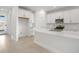Beautiful kitchen with an island, tile floors, stainless steel appliances, and white cabinets at 9127 Players Dr, Weeki Wachee, FL 34613