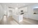 Beautiful kitchen with an island, tile floors, stainless steel appliances, and white cabinets at 9127 Players Dr, Weeki Wachee, FL 34613