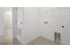 Utility room features a laundry hookup, tile floor, and wire shelving for ample storage at 9127 Players Dr, Weeki Wachee, FL 34613