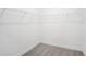 Spacious walk-in closet with wire shelving, carpeted floor, and ample storage space at 9127 Players Dr, Weeki Wachee, FL 34613