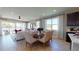 Inviting living space with a dining table, chairs, and natural light, creating a warm and welcoming atmosphere at 9229 Players Dr, Weeki Wachee, FL 34613