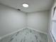 Small bedroom with marble tile flooring, white walls and a new window with blinds at 390 Hazel Cir, Punta Gorda, FL 33982