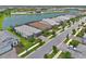 Aerial view of a neighborhood showcasing meticulously landscaped homes along a tranquil lake, creating a picturesque setting at 14553 Eagle Branch Dr, Nokomis, FL 34275