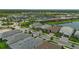 Scenic aerial shot of a new residential development showcasing manicured lawns, walking paths, and community amenities at 14553 Eagle Branch Dr, Nokomis, FL 34275
