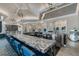 Modern bar area with marble countertop and stylish seating at 14553 Eagle Branch Dr, Nokomis, FL 34275