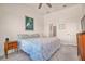 Cozy bedroom featuring a ceiling fan, an ensuite bathroom, and a neutral decor at 14553 Eagle Branch Dr, Nokomis, FL 34275