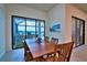 Spacious dining area with sliding glass doors and views of the outdoor pool area at 14553 Eagle Branch Dr, Nokomis, FL 34275