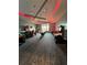 Spacious game room featuring arcade games and vibrant lighting design at 14553 Eagle Branch Dr, Nokomis, FL 34275