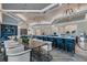 Elegant lounge featuring modern decor, stylish furniture, a bar area, and contemporary lighting fixtures at 14553 Eagle Branch Dr, Nokomis, FL 34275