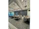 Well-appointed meeting room with ample seating, modern lighting, and a sleek design ideal for gatherings at 14553 Eagle Branch Dr, Nokomis, FL 34275