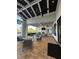 Inviting outdoor patio with comfortable seating, fireplace, and serene views of the pool at 14553 Eagle Branch Dr, Nokomis, FL 34275
