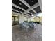 Stylish patio lounge area with comfortable seating and views of the surrounding landscape at 14553 Eagle Branch Dr, Nokomis, FL 34275