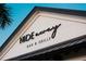 Close-up of the restaurant sign for the Hideaway Bar & Grille, a local hot spot at 14553 Eagle Branch Dr, Nokomis, FL 34275